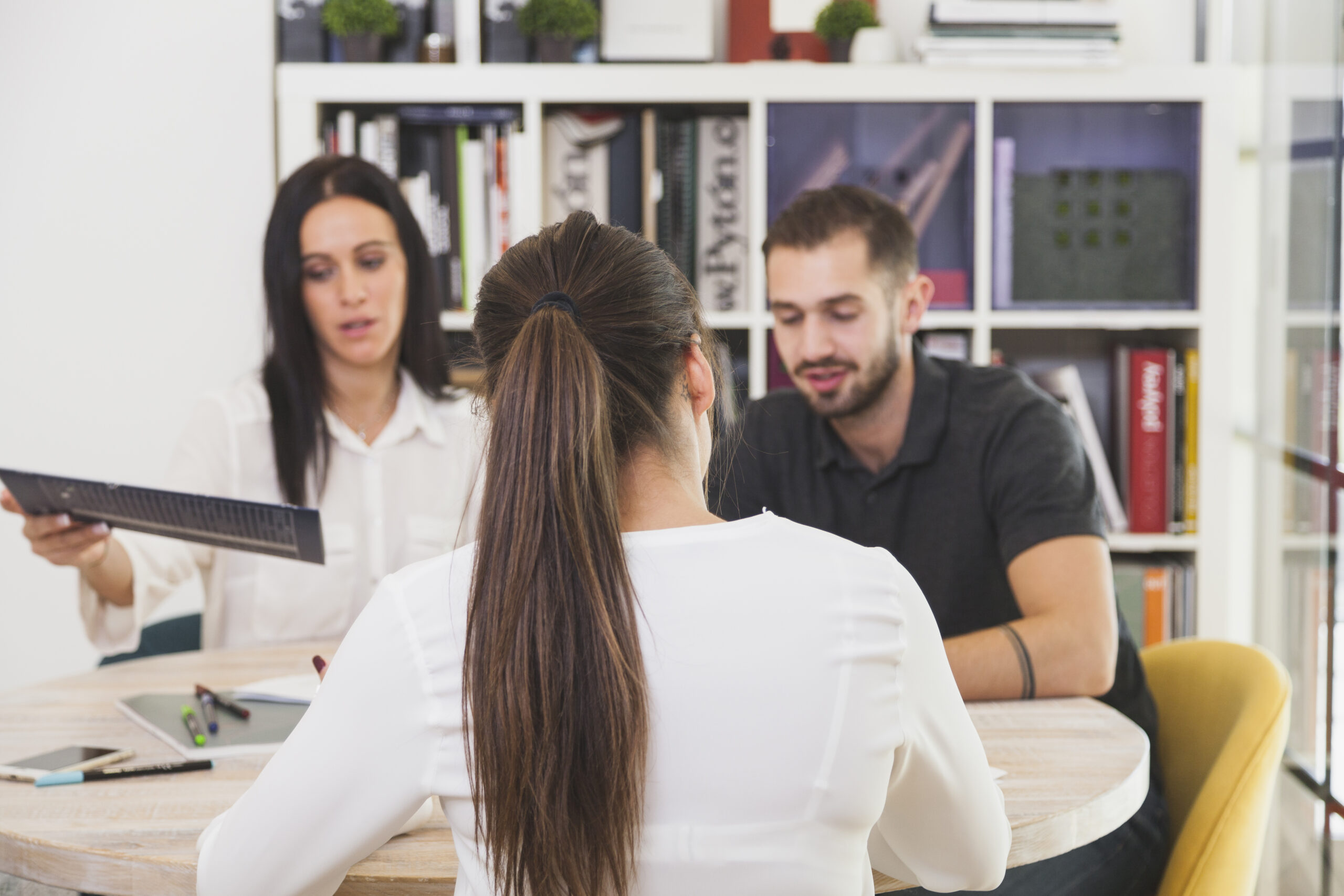 woman sitting office talking scaled